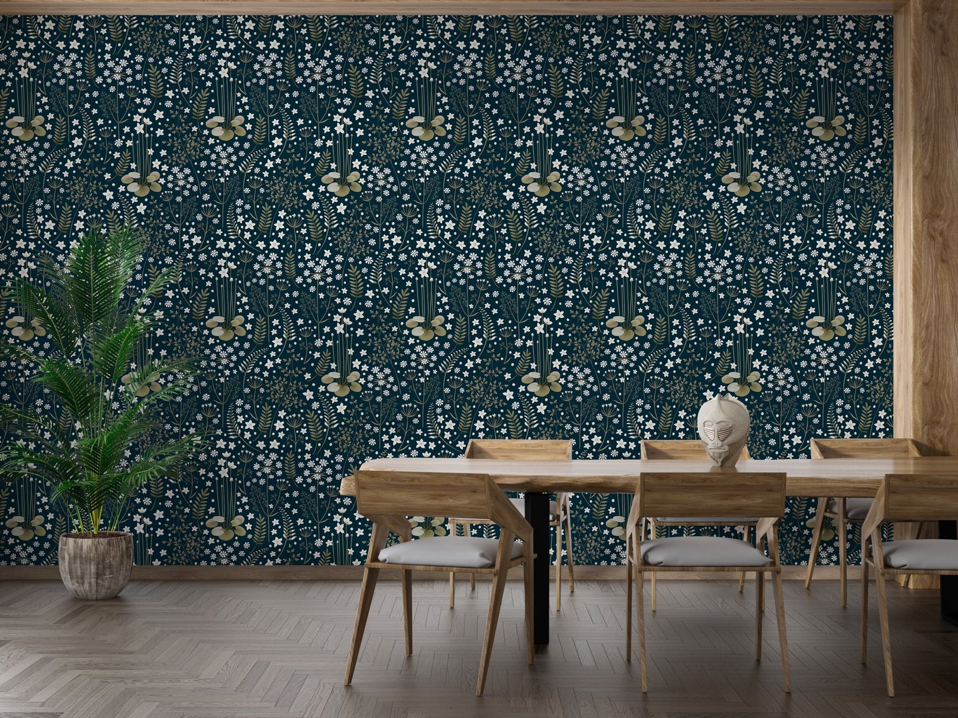 Dark blue leaf wallpaper in a dining room with a large wooden table and chairs.