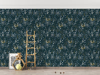Floral wallpaper in a playroom with wooden toys and a small ladder.