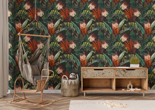 Tropical leaves wallpaper with hanging chair and wooden console in a playroom.