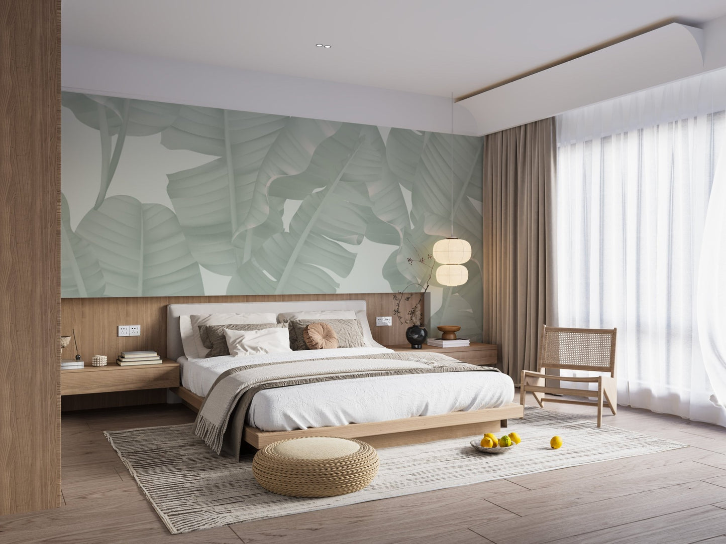 Floral seamless green banana leaves wall mural in a bedroom with wooden furniture.