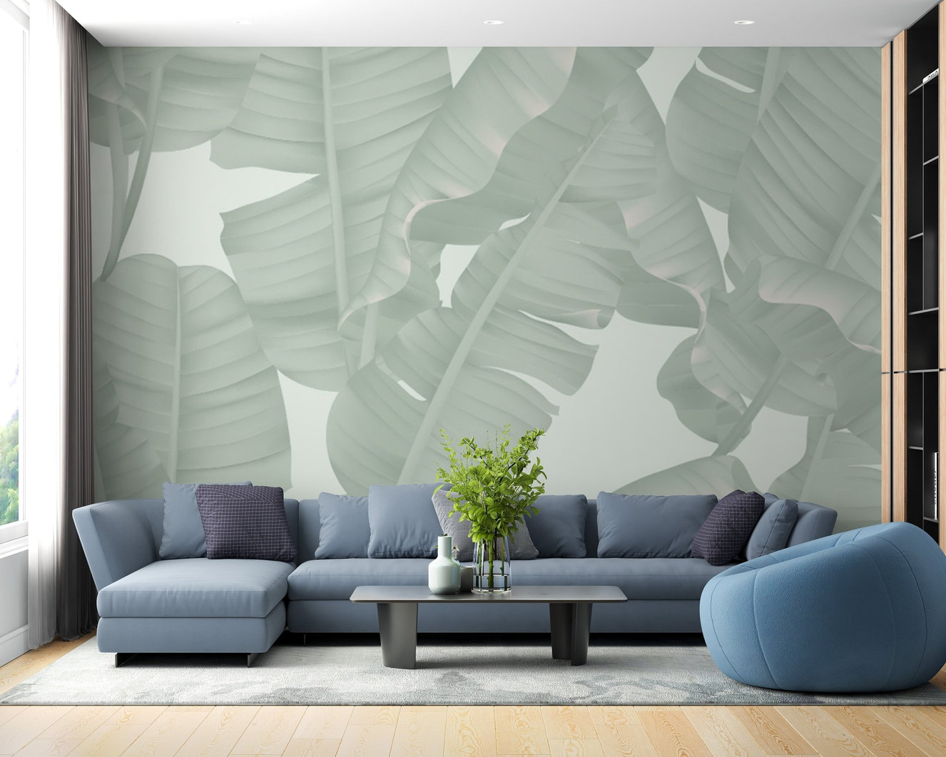 Green banana leaves wall mural behind a blue sectional sofa in a modern living room.