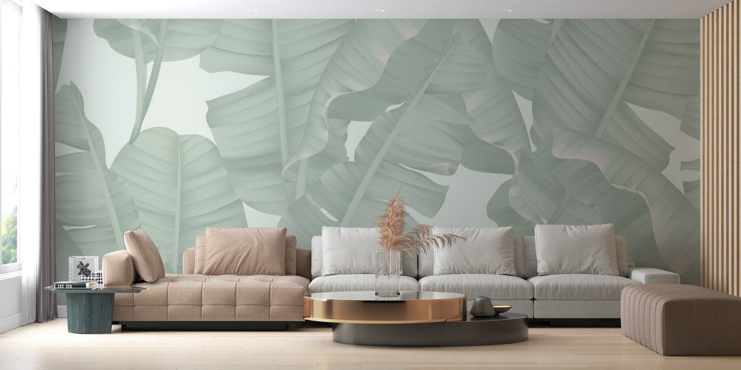 Floral seamless green banana leaves wall murals in a living area with a grey couch.
