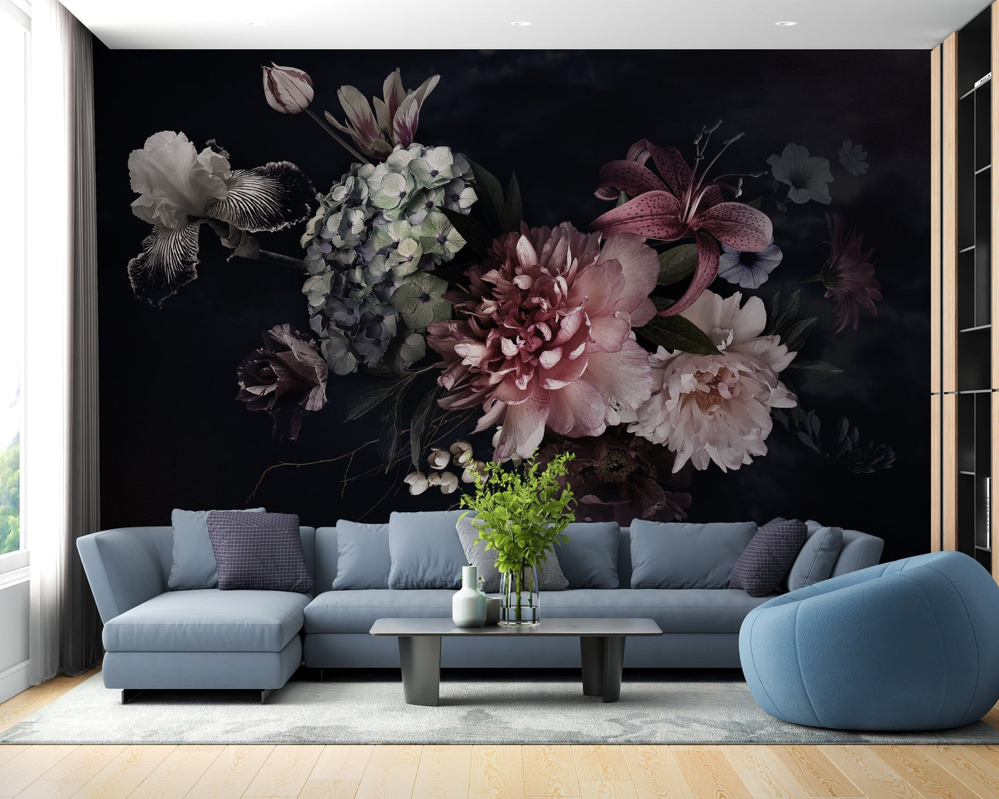 Blue sectional sofa paired with a botanical floral print wall mural on a dark background.