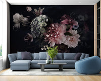 Blue sectional sofa paired with a botanical floral print wall mural on a dark background.