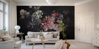 Dark floral wall mural with pink and green blooms in a bright modern apartment.