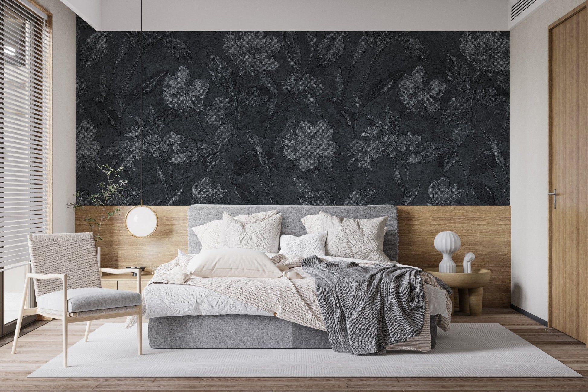 Moody flower pattern on black background wallpaper as a bedroom feature wall.
