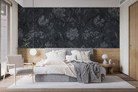 Moody flower pattern on black background wallpaper as a bedroom feature wall.