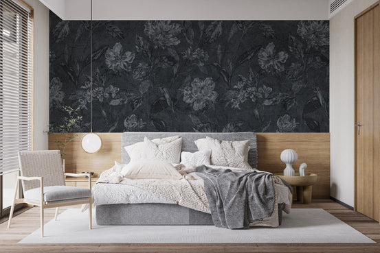 Moody flower pattern on black background wallpaper as a bedroom feature wall.