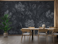 Flower pattern on black background wallpaper in a dining area with green indoor plants.