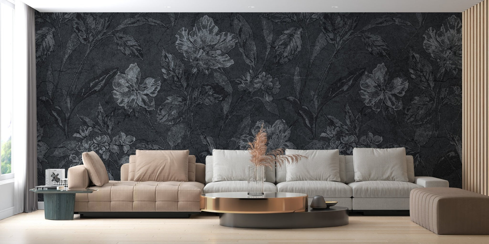 Large scale flower wallpaper behind a low profile grey sofa in a contemporary lounge.
