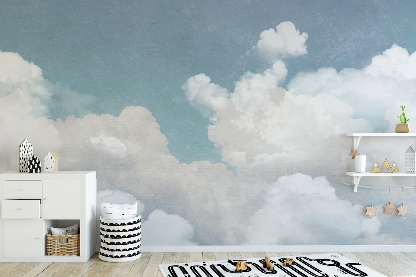 Soft gradient wallpaper mural featuring white cloud forms.