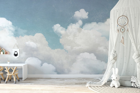 Fluffy clouds wallpaper mural with soft white clouds on blue sky.