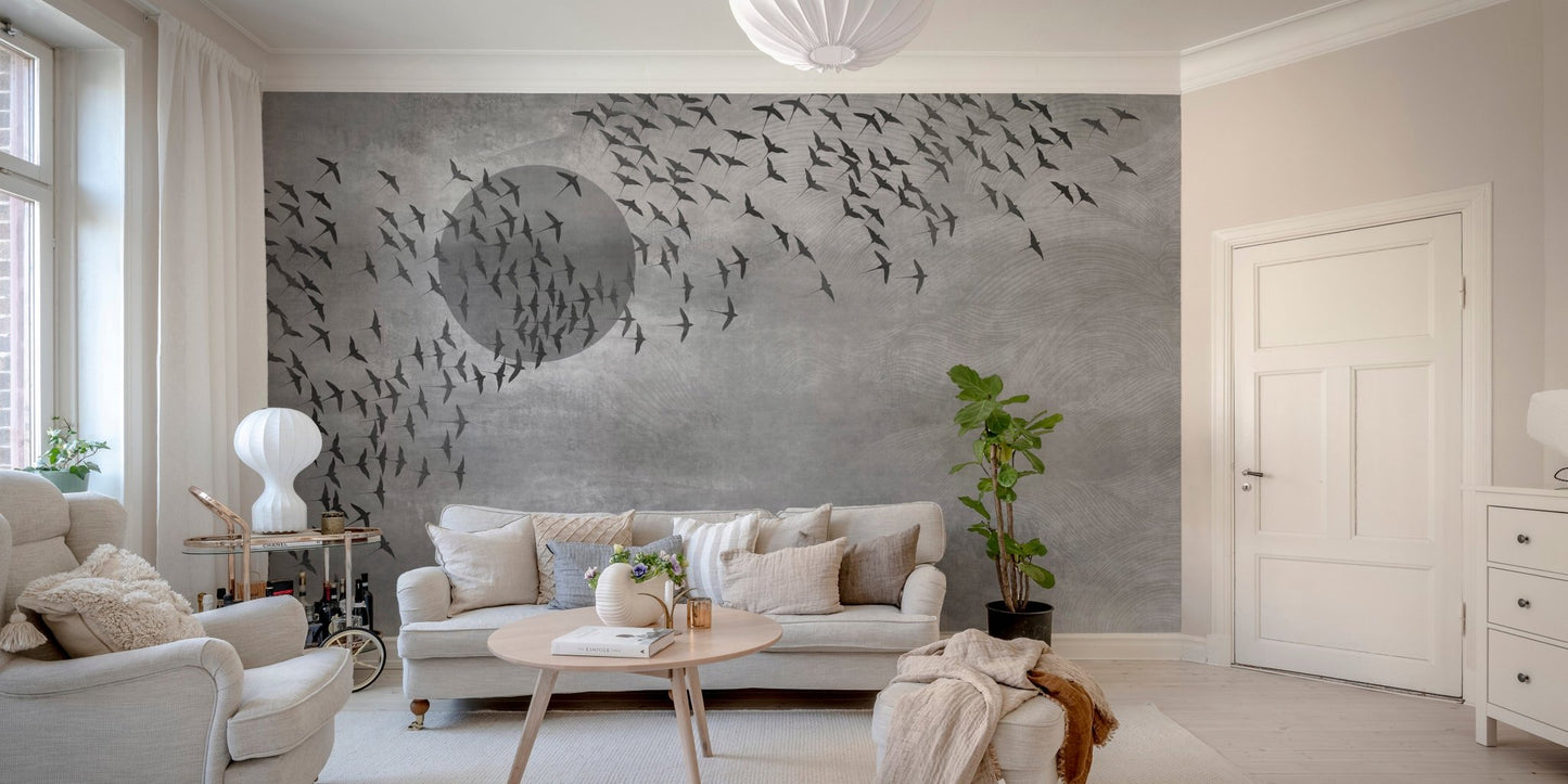 Flying birds wall mural installed behind a white sofa in a minimalist living room.
