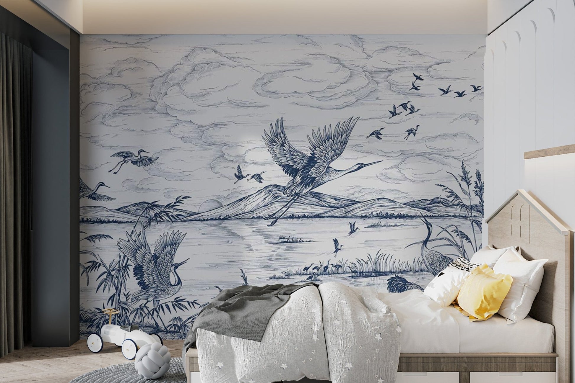Illustrated flying birds wall mural in blue and white for child's sleeping area.