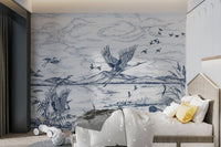 Illustrated flying birds wall mural in blue and white for child's sleeping area.