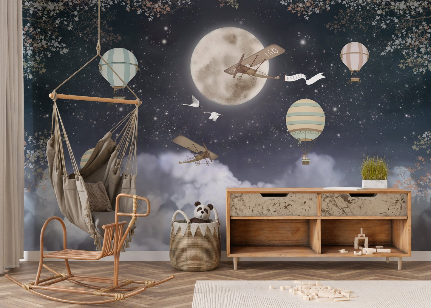 Nursery accent wall mural with moon and clouds over dark nights.