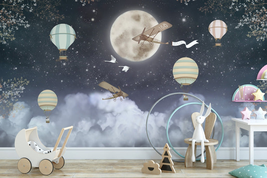 Dark night wall mural with balloons and planes in a toddler play area.