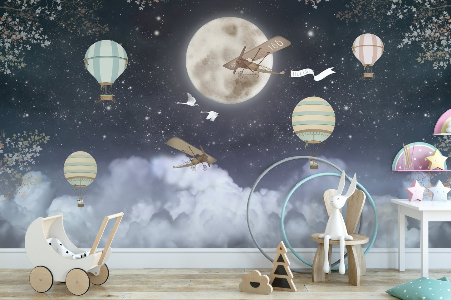 Dark night wall mural with balloons and planes in a toddler play area.