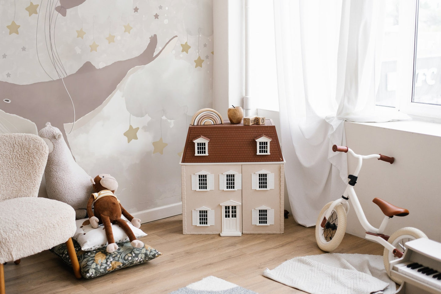 Dreamy floating whale wallpaper wall mural in soft neutral color.