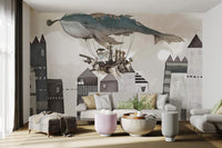 Vintage ship and flying whale mural for bright living space.