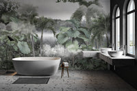 Serene misty forest with tropical foliage wall mural in modern bathroom.