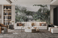 Mist-covered forest with lush tropical plants wall mural in living room.