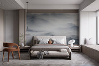 Foggy Hills Mountain Wall mural in modern bedroom with grey bed and wooden chair.