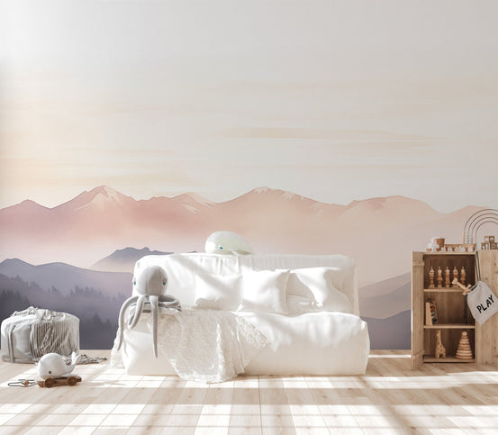 Foggy covered mountain range wallpaper in soft peach and grey tones.