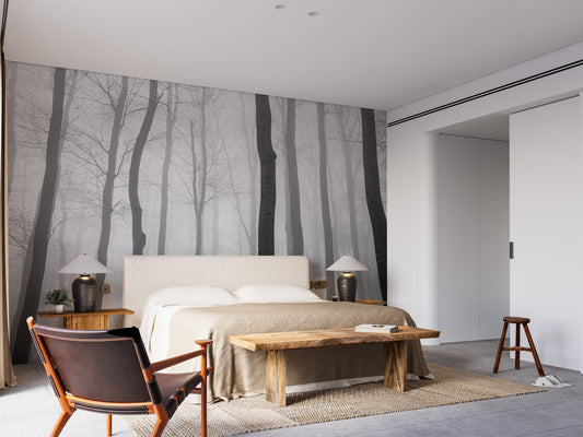 Foggy Jungle View Wall Mural in a bedroom with wooden furniture.