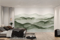 Sage green mountain wall mural with hazy watercolor finish for bedroom.