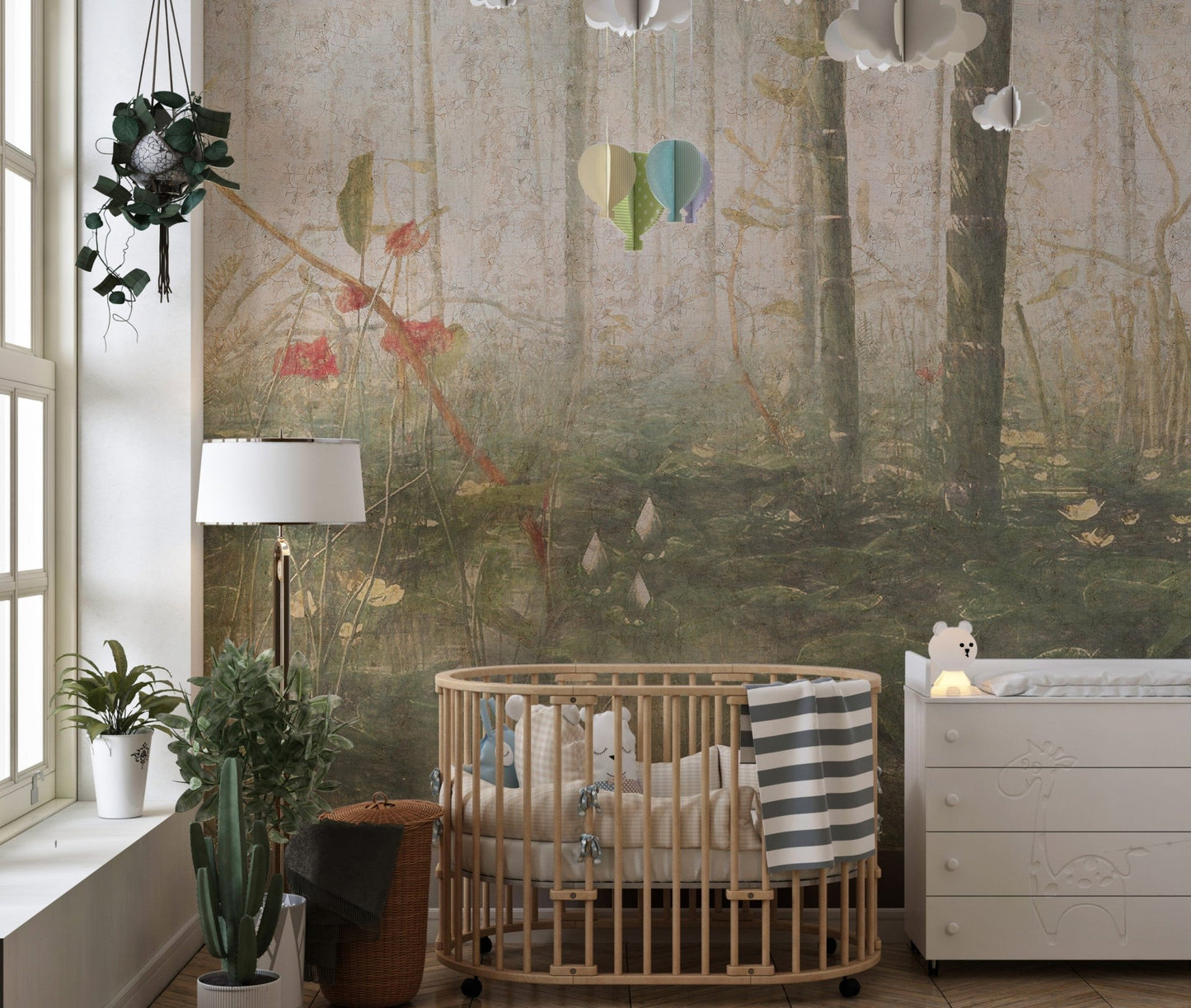 Nursery room with a wooden crib and foggy forest wall mural.