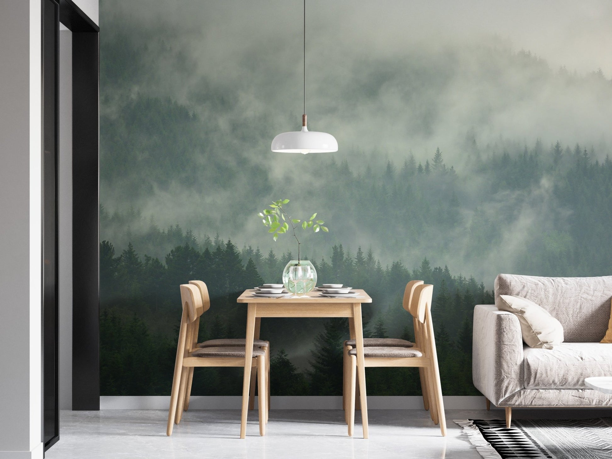Alpine forest wall mural in a dining area with wooden table and chairs.