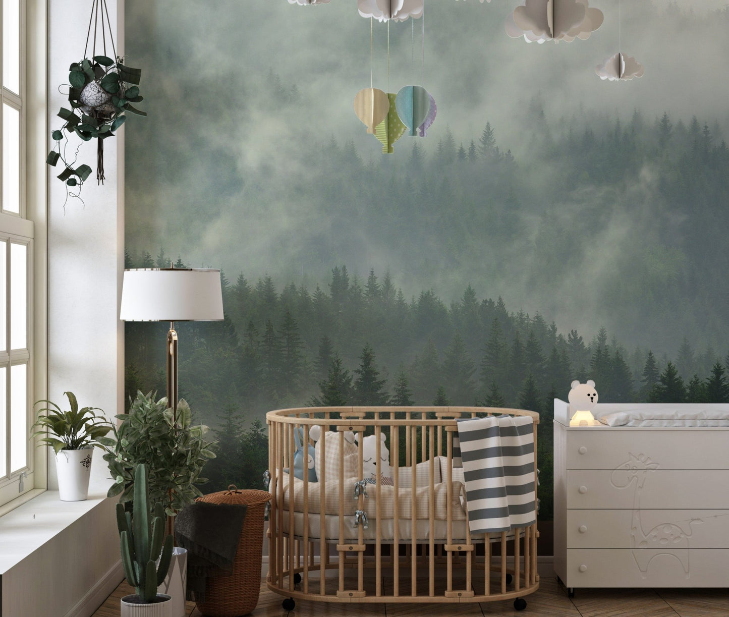 Foggy Tropical Forest View Wall Mural in a nursery with a wooden crib.