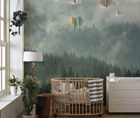 Foggy Tropical Forest View Wall Mural in a nursery with a wooden crib.