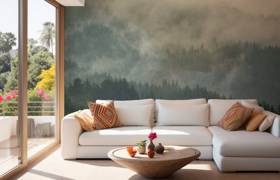 Foggy mountain wall mural behind a white sectional couch in a bright living area.