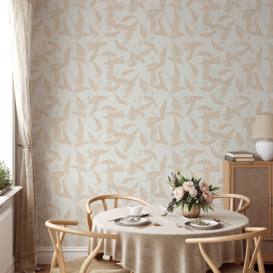 Foliage wallpaper in a dining area with a round table and wooden chairs.