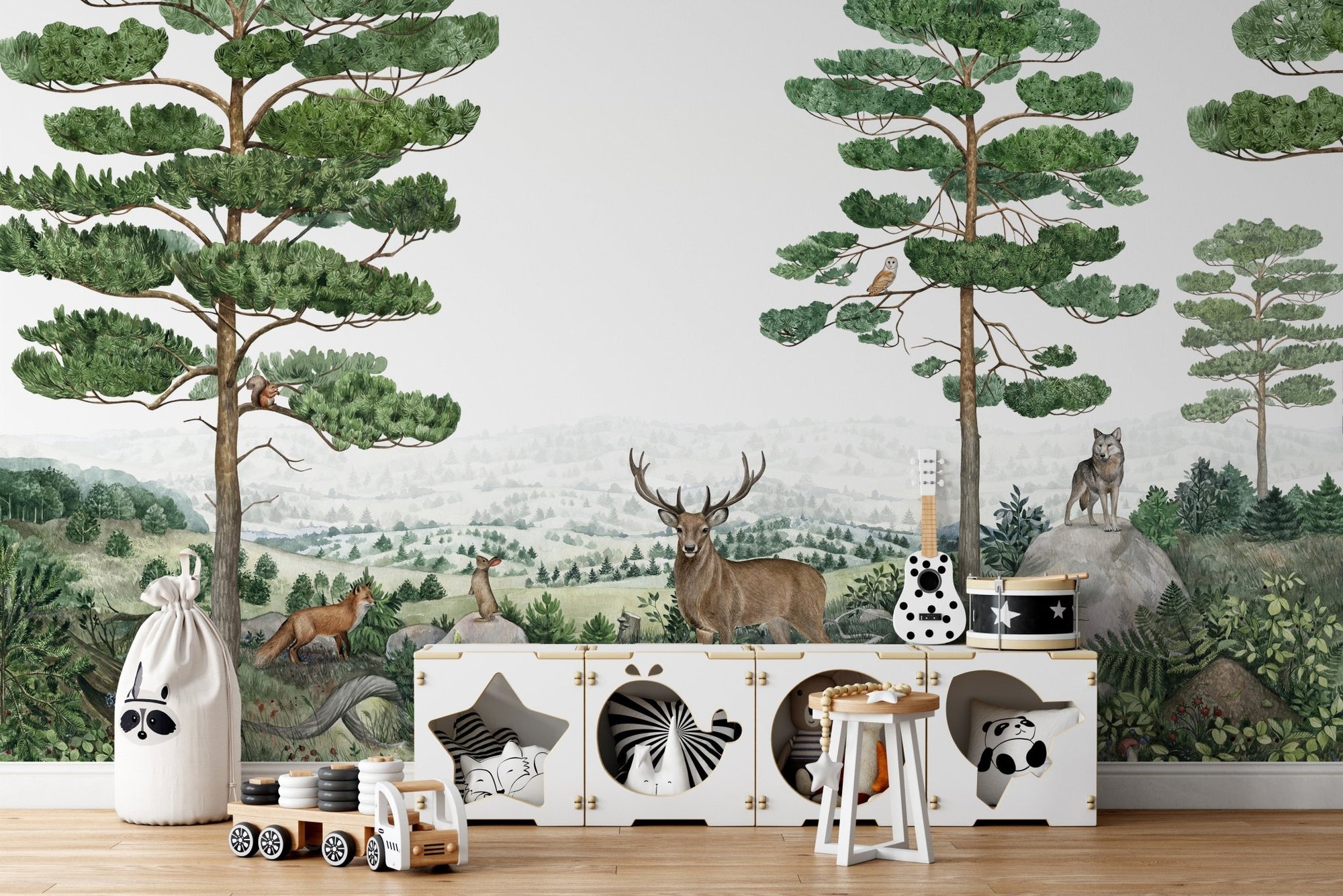 Forest wildlife scene peel and stick wallpaper with deer and pine trees.