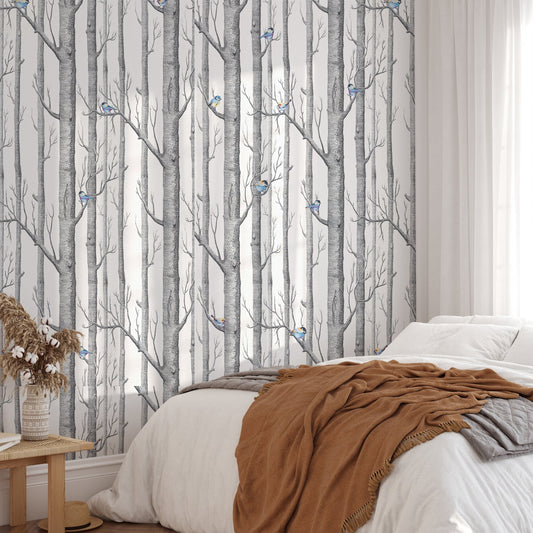 Forest White Background Scandinavian Style Wallpaper in a bedroom with brown linens.