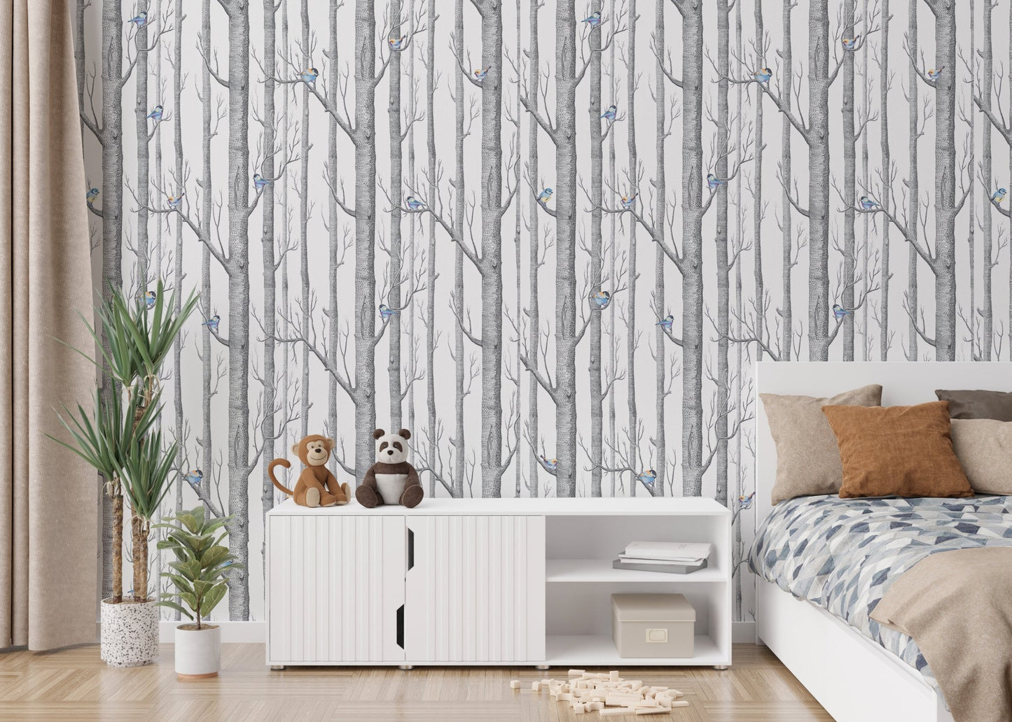 Nature themed forest wallpaper with blue bird accents in a minimalist kids bedroom.