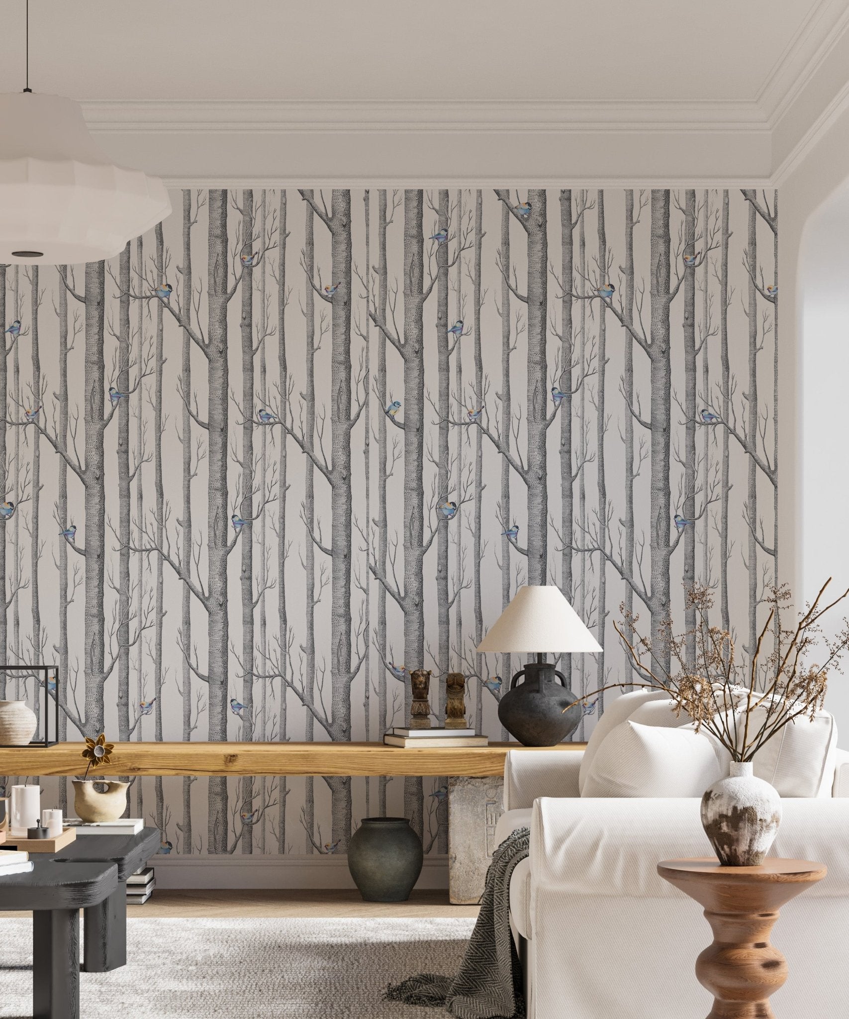Monochrome forest wallpaper with subtle blue bird details in a contemporary flat.