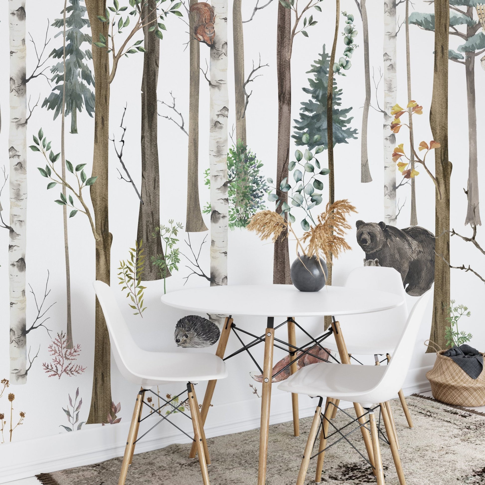 Small dining area with a woodland forest wall mural.