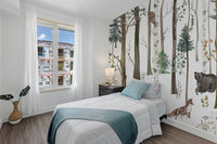 Bright bedroom with a woodland forest wall mural.