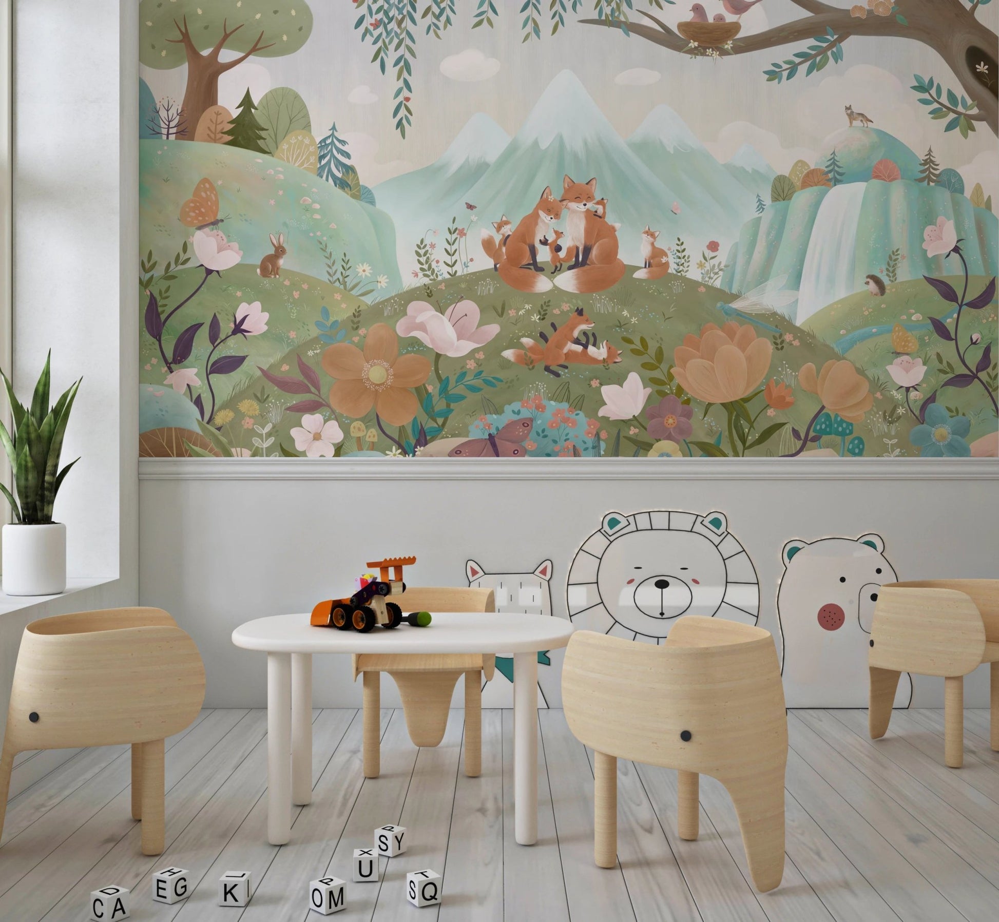 Playroom wall mural with child-sized table, chairs, and woodland fox pattern.