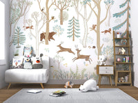 Small seating area for children featuring a forest animal wall mural design.