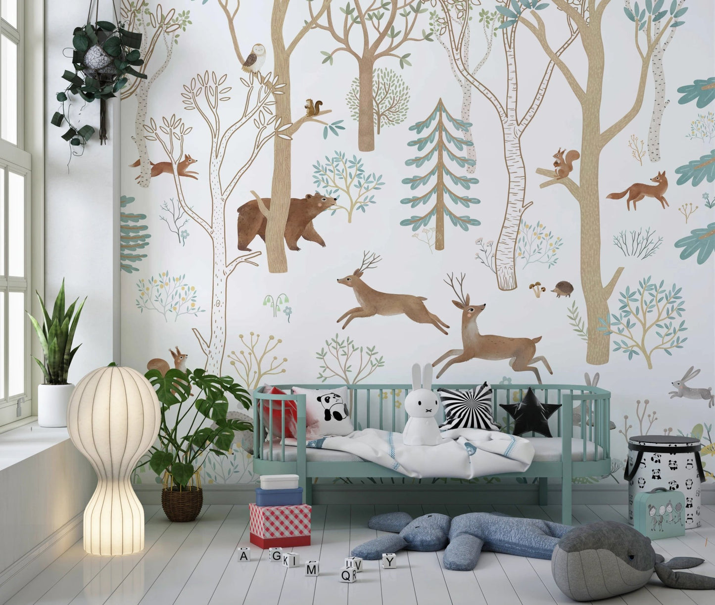 Scandinavian style wall mural with forest animals in a modern nursery.