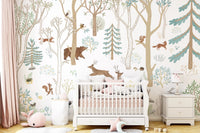 Frisky Forest Blue Wall Mural behind a white crib in a baby nursery.