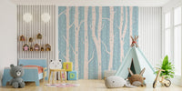 Birch forest pattern wall mural behind a blue kids armchair and play tent.