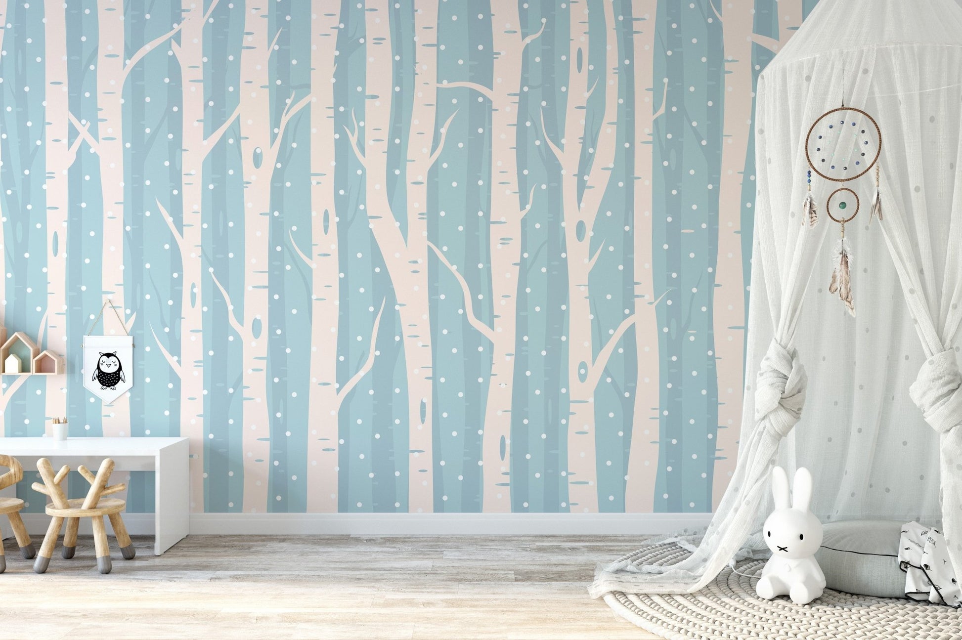 Minimalist forest branch wall mural in a bright bedroom with a white play house.
