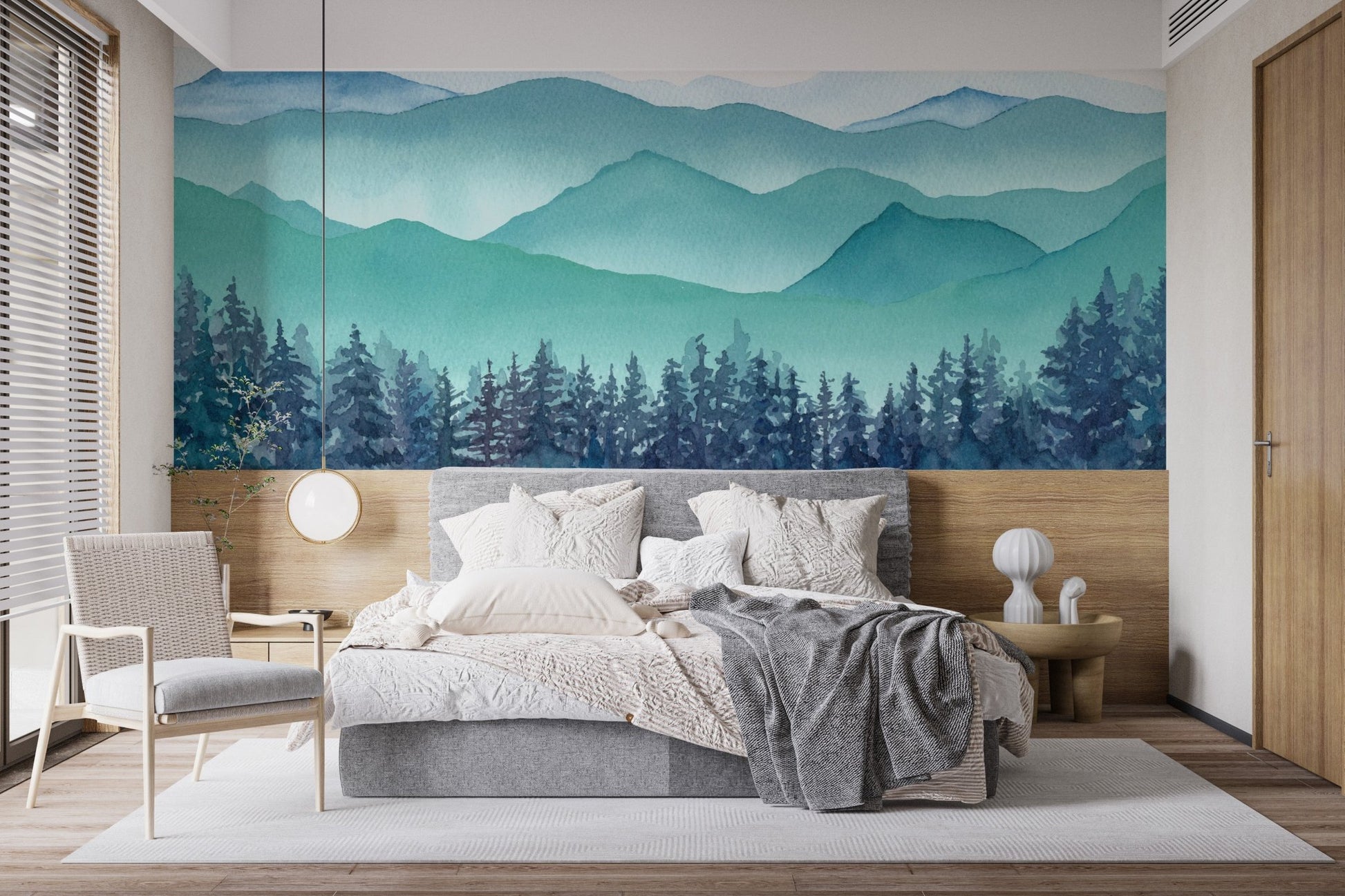 Blue watercolor hills wall mural in a minimalist bedroom with natural light.