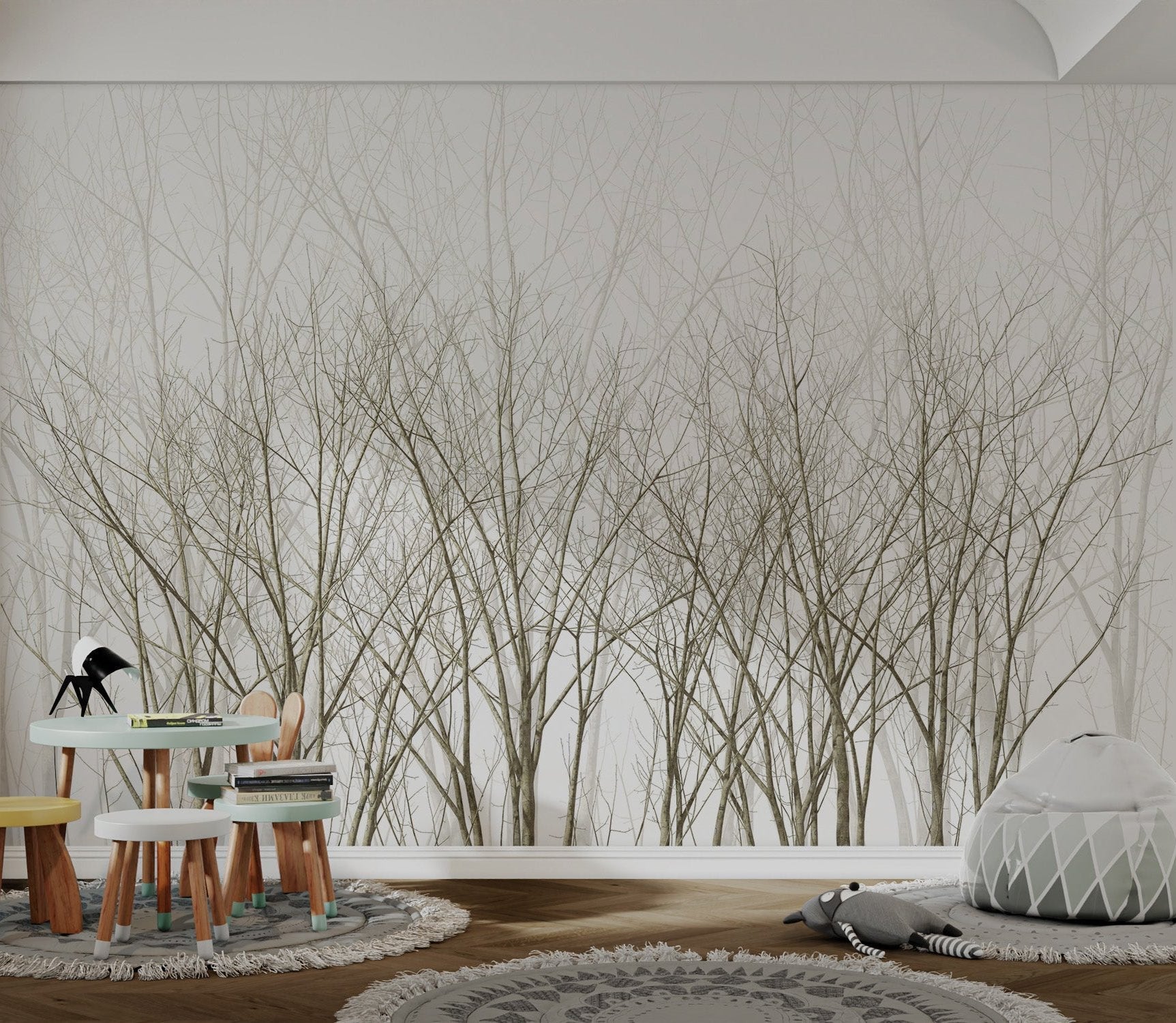 Scandinavian style bare forest wall mural in neutral white tone in playroom.